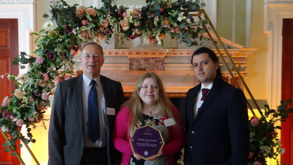 Jon, Bethany and Aaron from Majestic, holding the award plaque